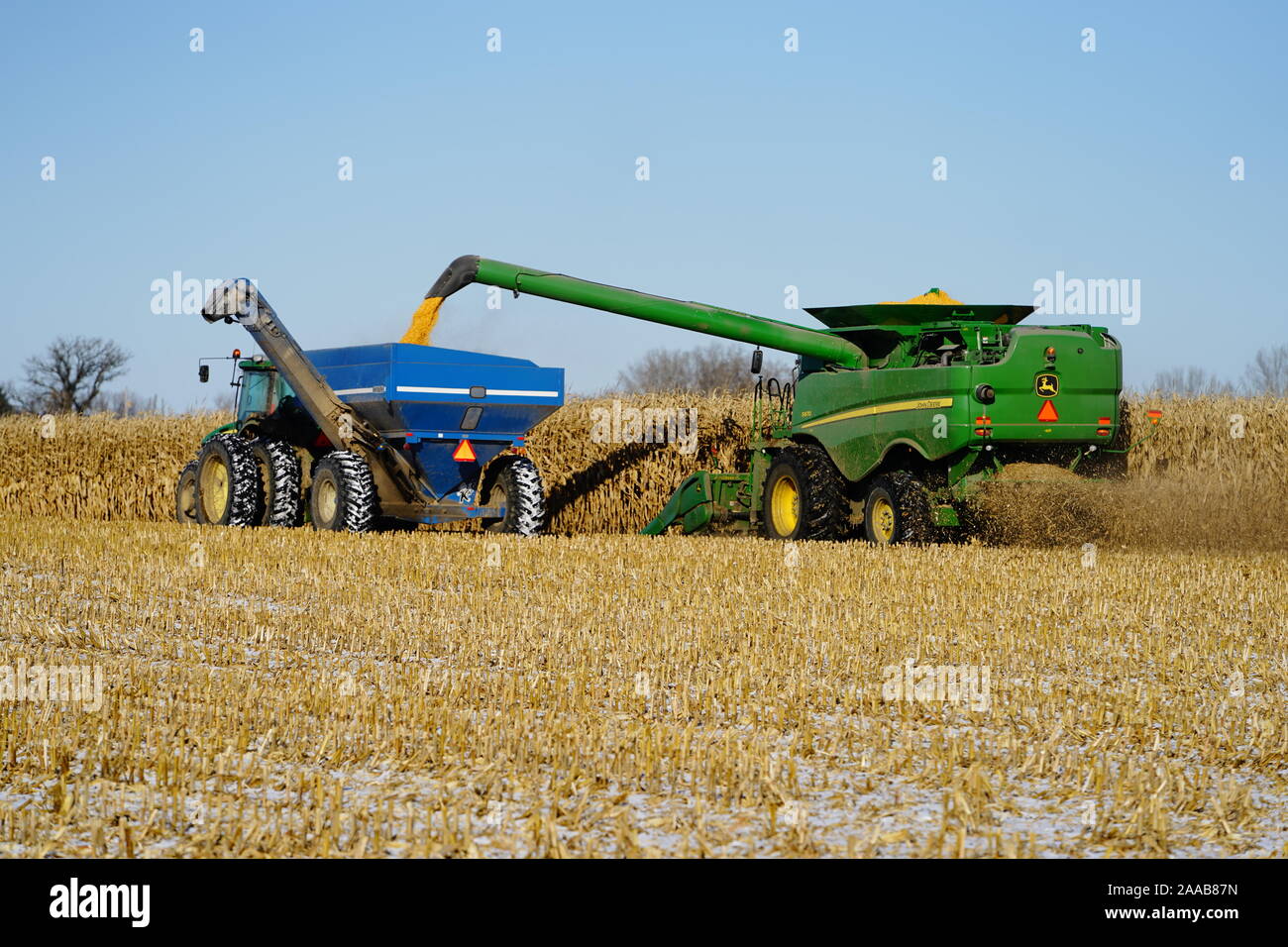 John Deere Combine being used to farm and gather animal feed stocks