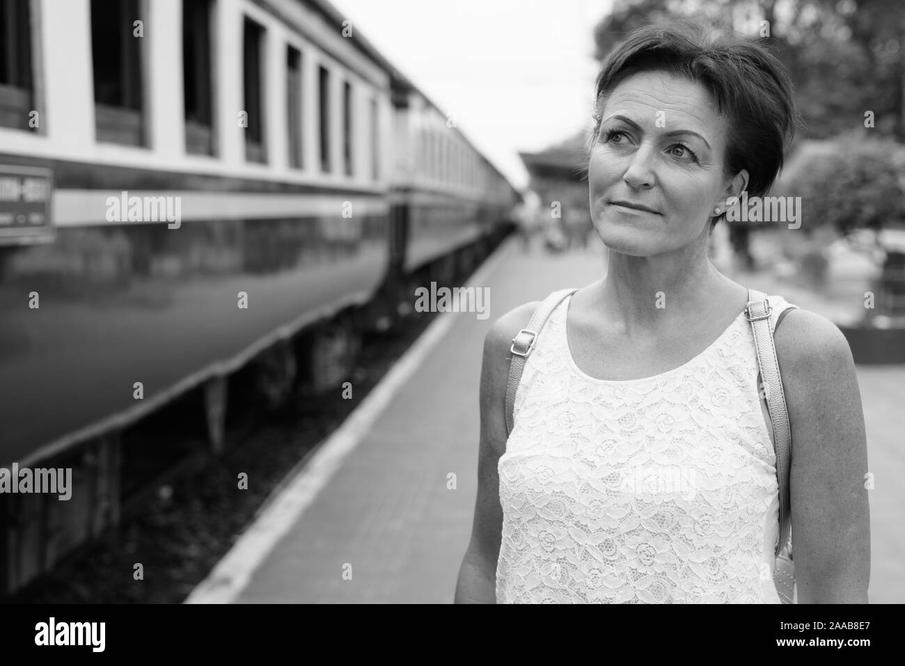 Mature beautiful Scandinavian tourist woman at railway station Stock Photo