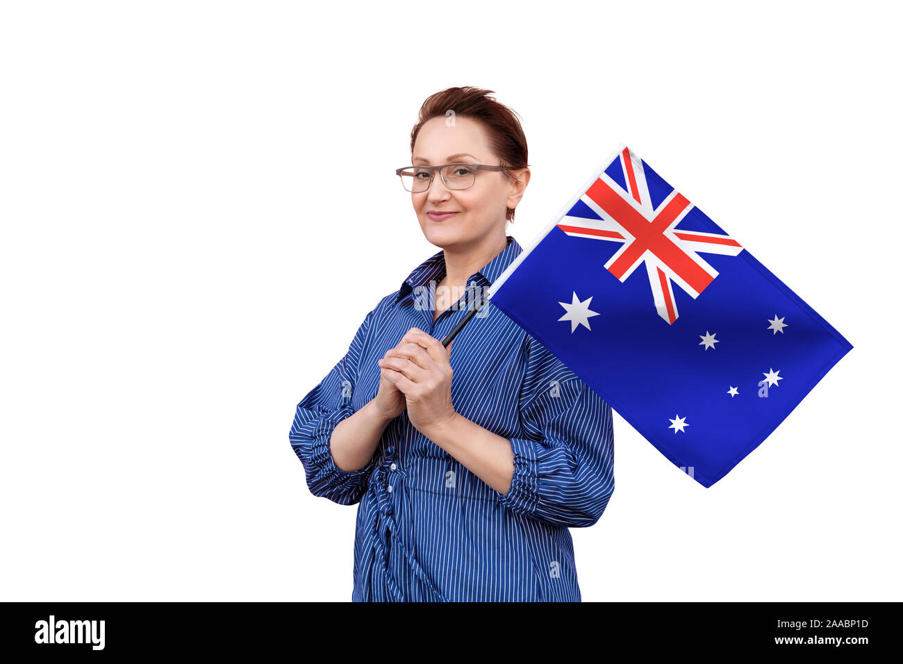 Australia flag. Woman holding Australian flag. Nice portrait of middle aged  lady 40 50 years old holding a large flag isolated on white background  Stock Photo - Alamy