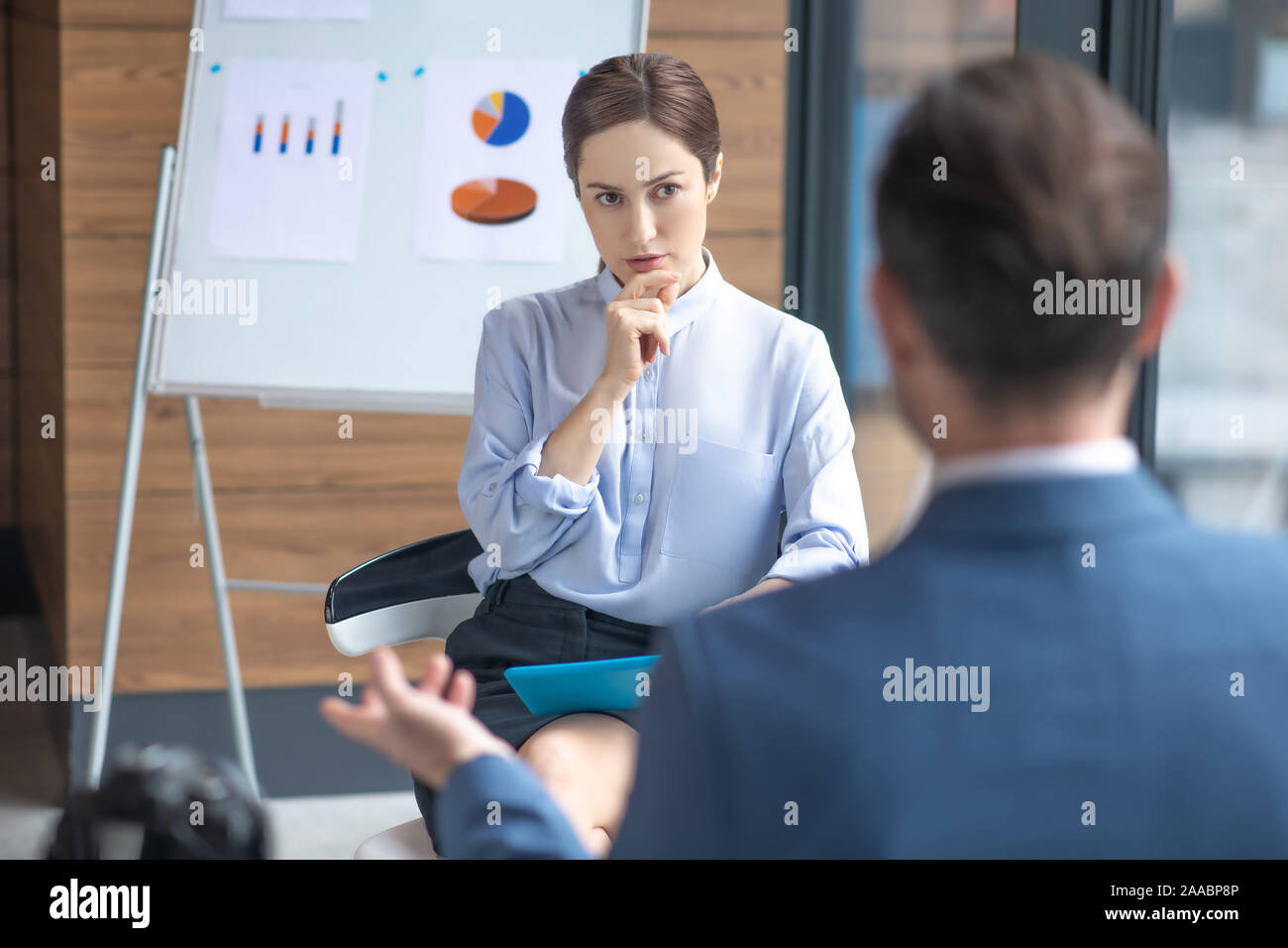Journalist Listening To Businessman Attentively While Asking