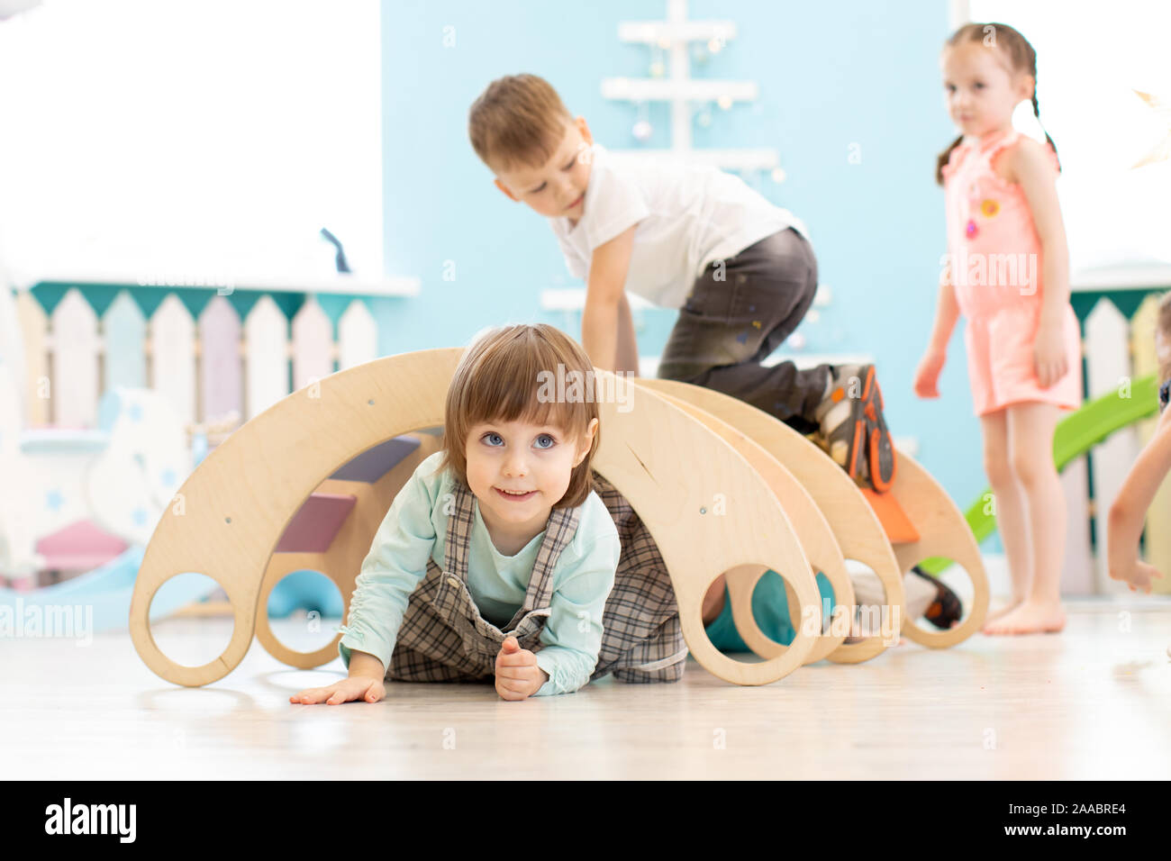 Children play in playroom or daycare centre Stock Photo