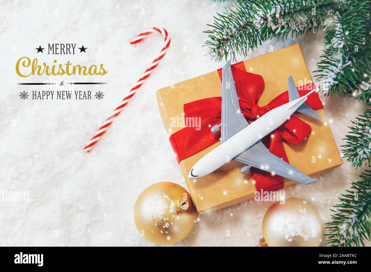 Christmas travel background. model of an airplane with a festive stocking  Stock Photo - Alamy