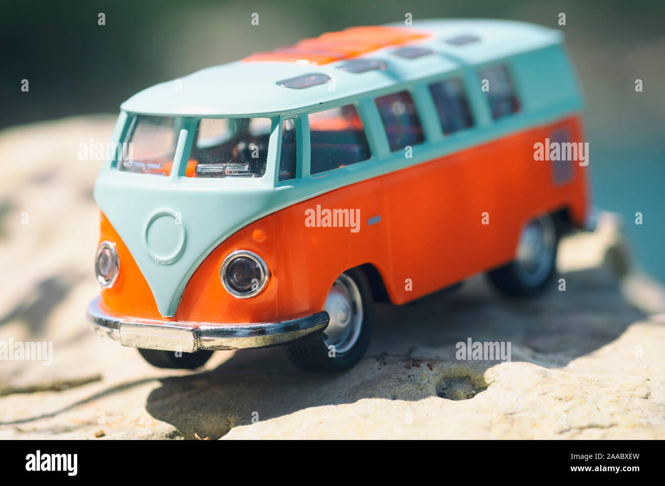 https://c8.alamy.com/comp/2AABXEW/vintage-miniature-orange-and-blue-van-travel-concept-2AABXEW.jpg