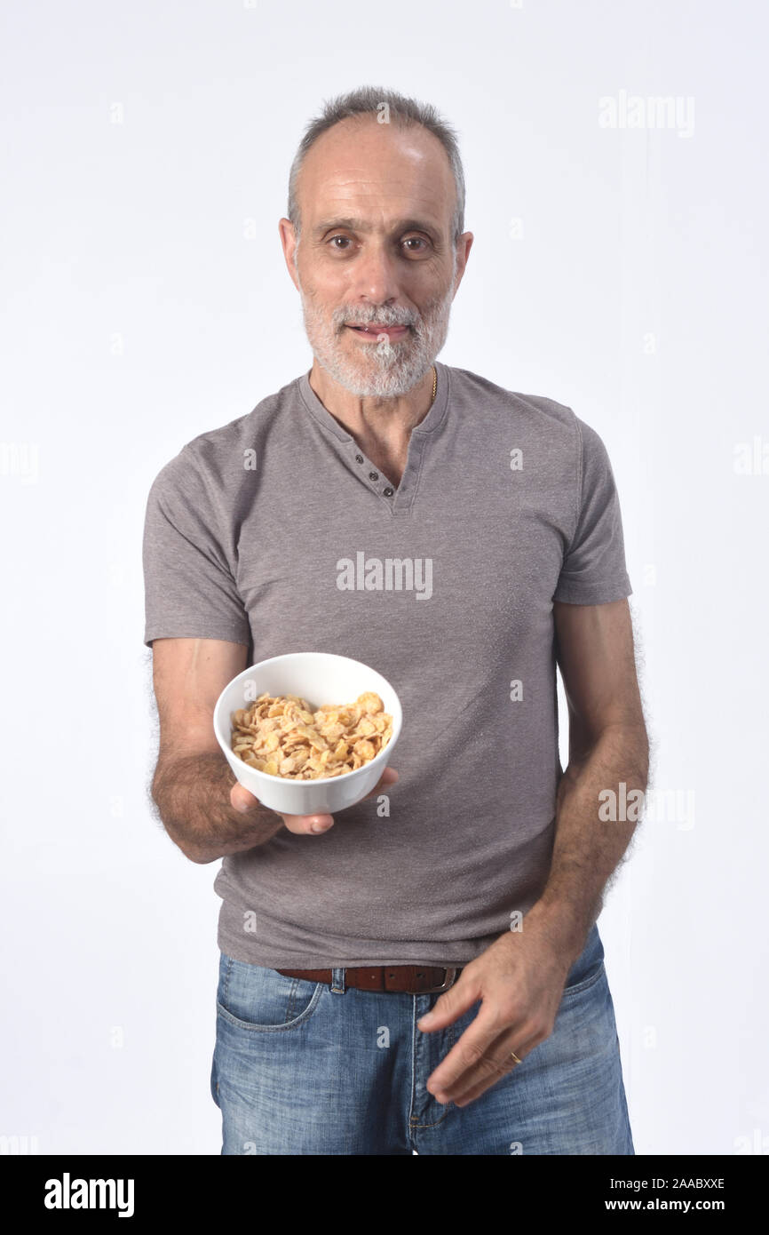 man with corn flakes bar on white background Stock Photo Alamy