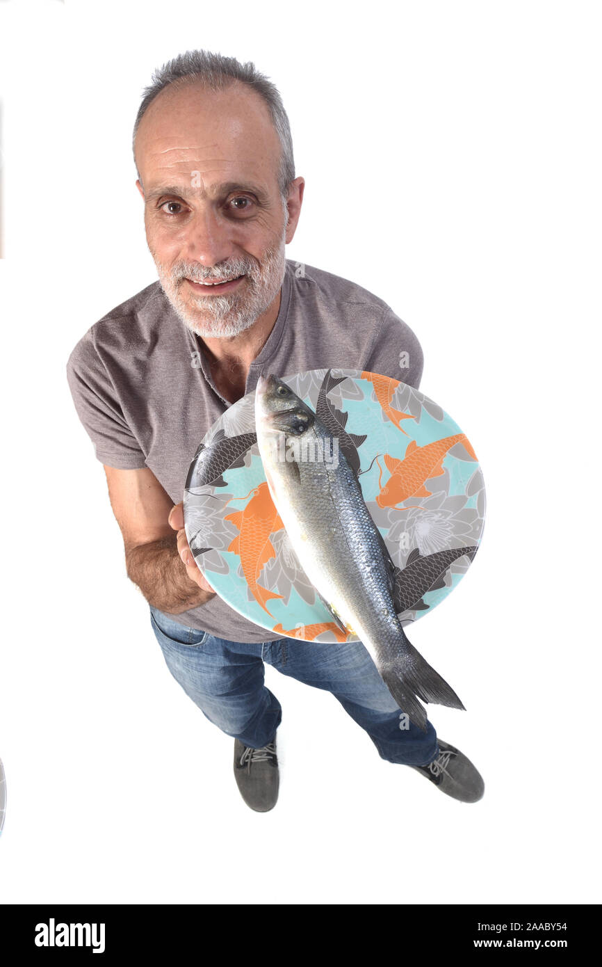 man with sea bass on white background Stock Photo Alamy