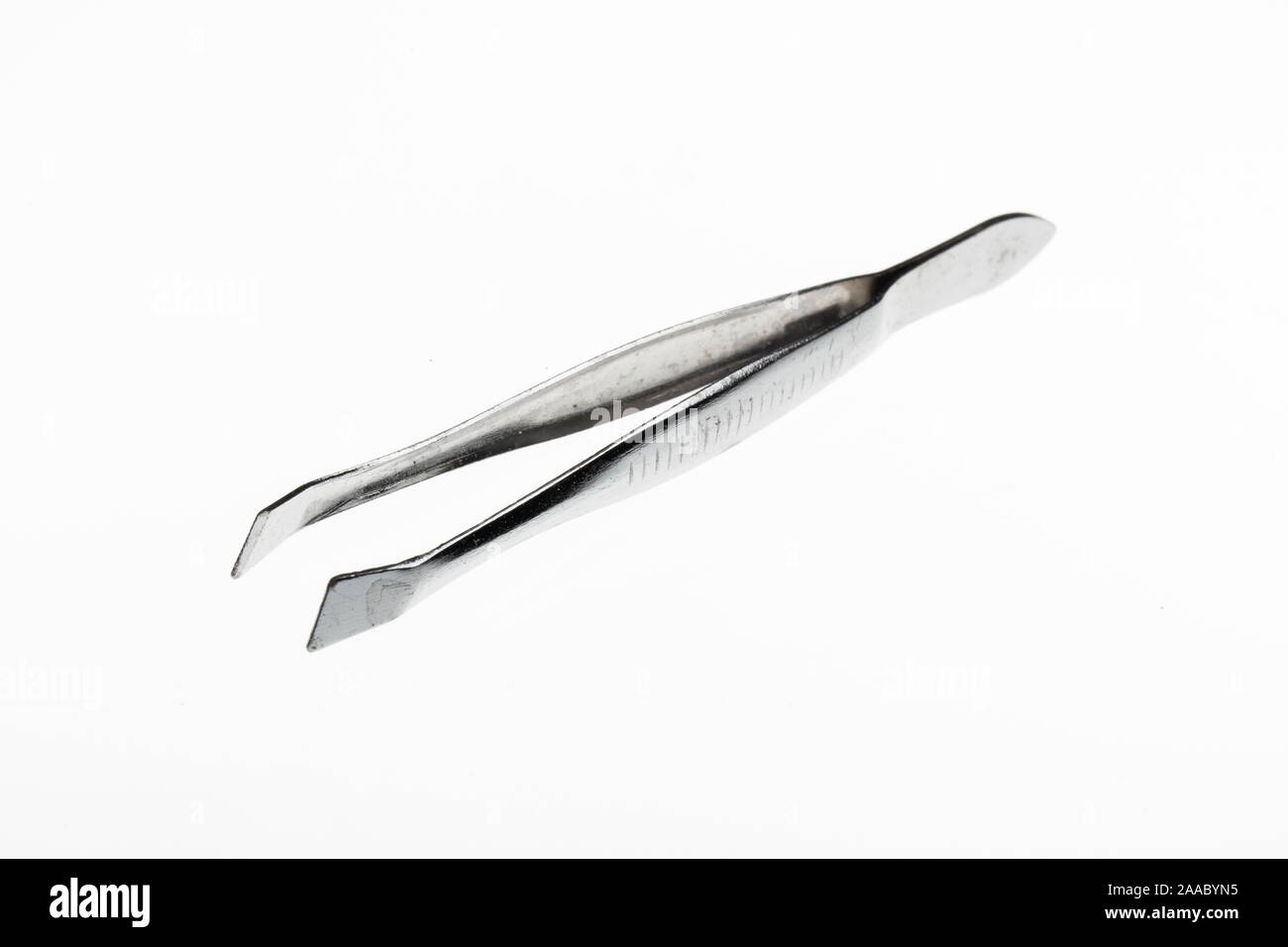 Metal tweezer isolated on a white background Stock Photo