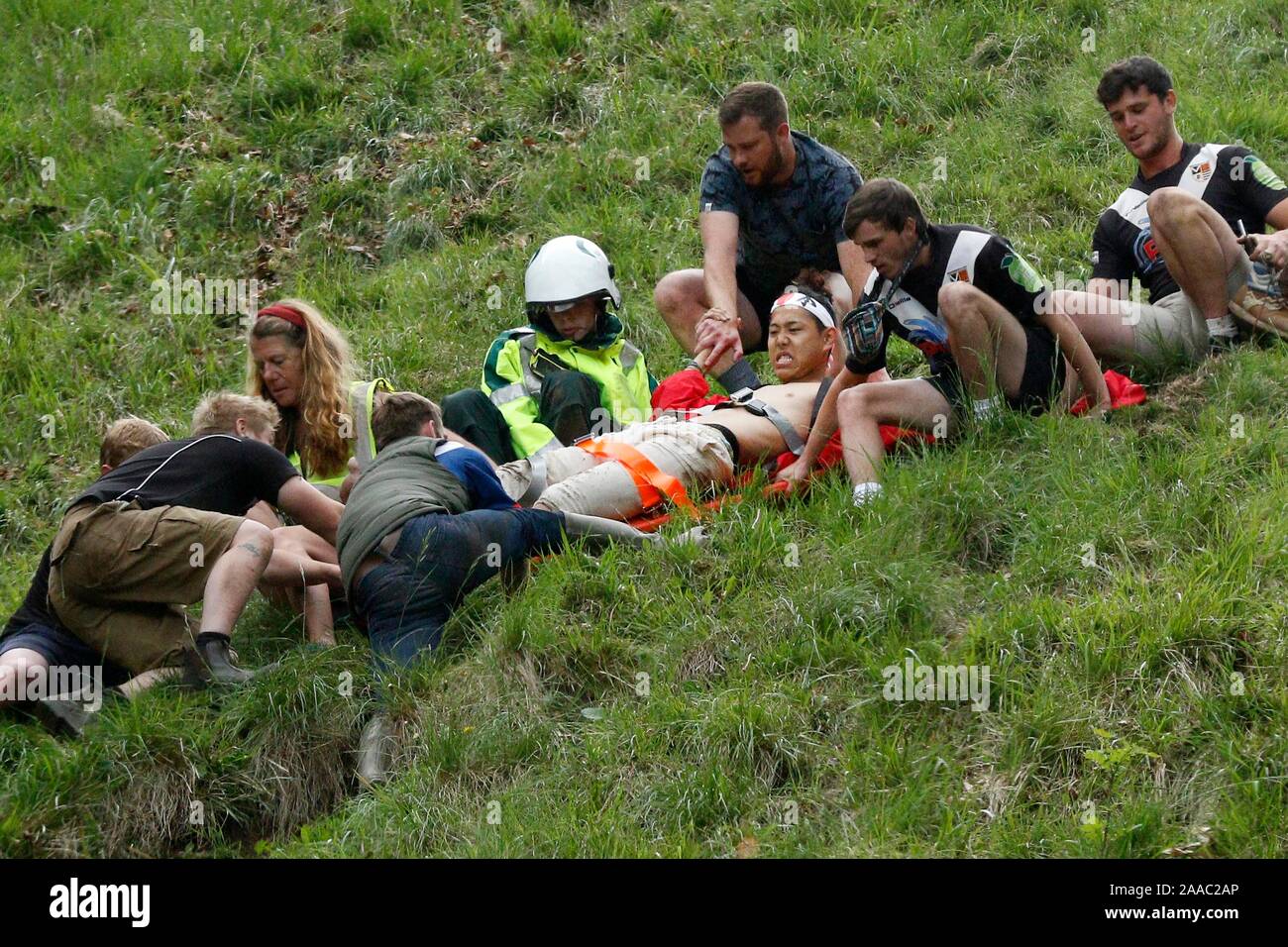 Second mens's downhill race competitor helped off the hill with a