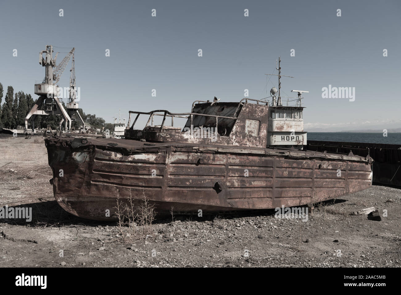 rusting boat at abandoned soviet port, Balykchy, Kyrgyzstan Stock Photo