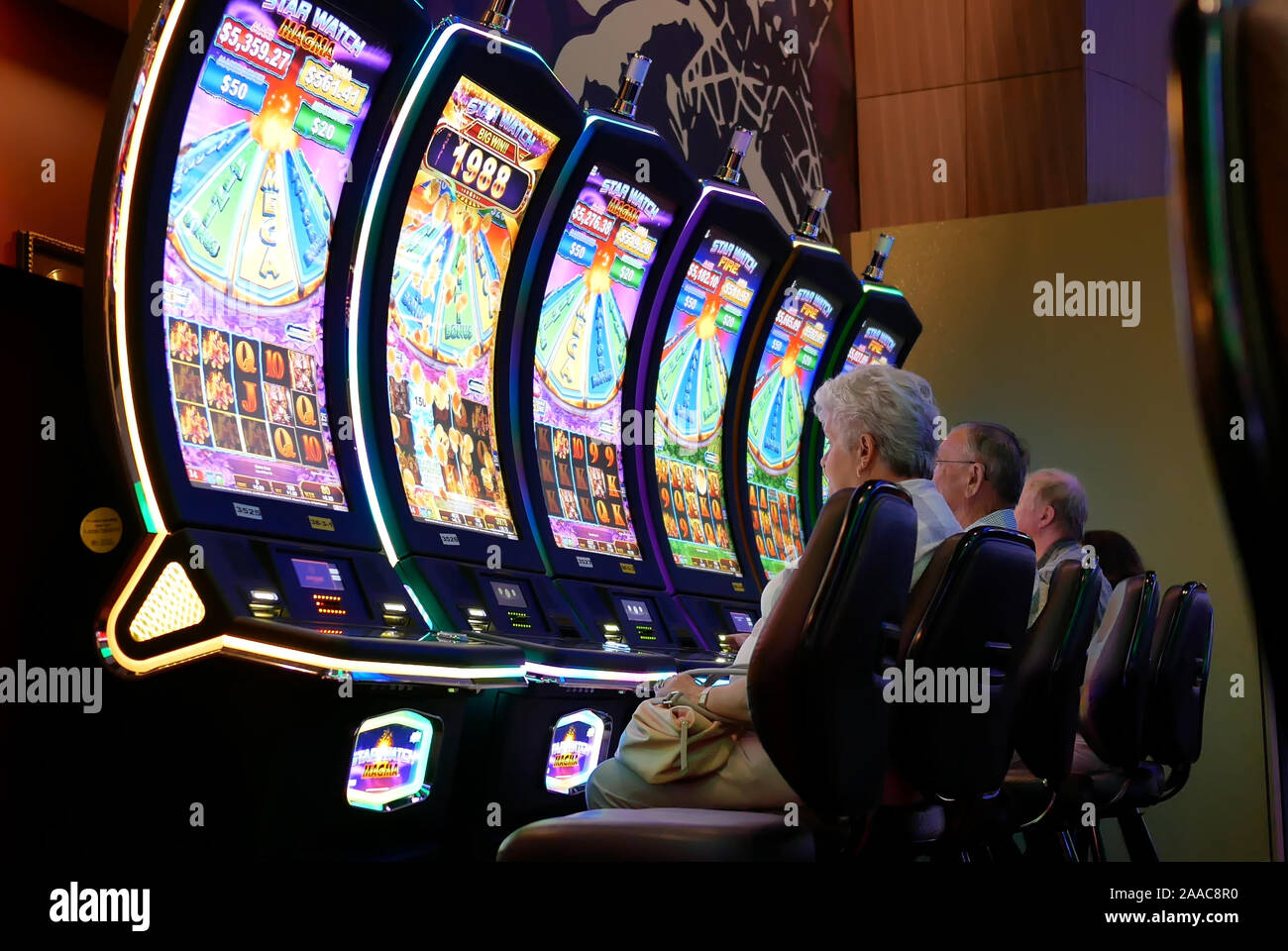 Coquitlam, BC, Canada - May 31, 2019 : Motion of people playing slot machine inside Casino Stock Photo