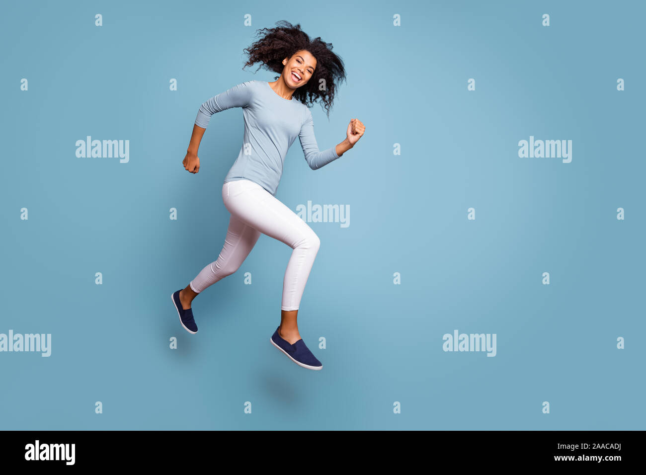 Full length body size turned photo of cheerful positive cute nice