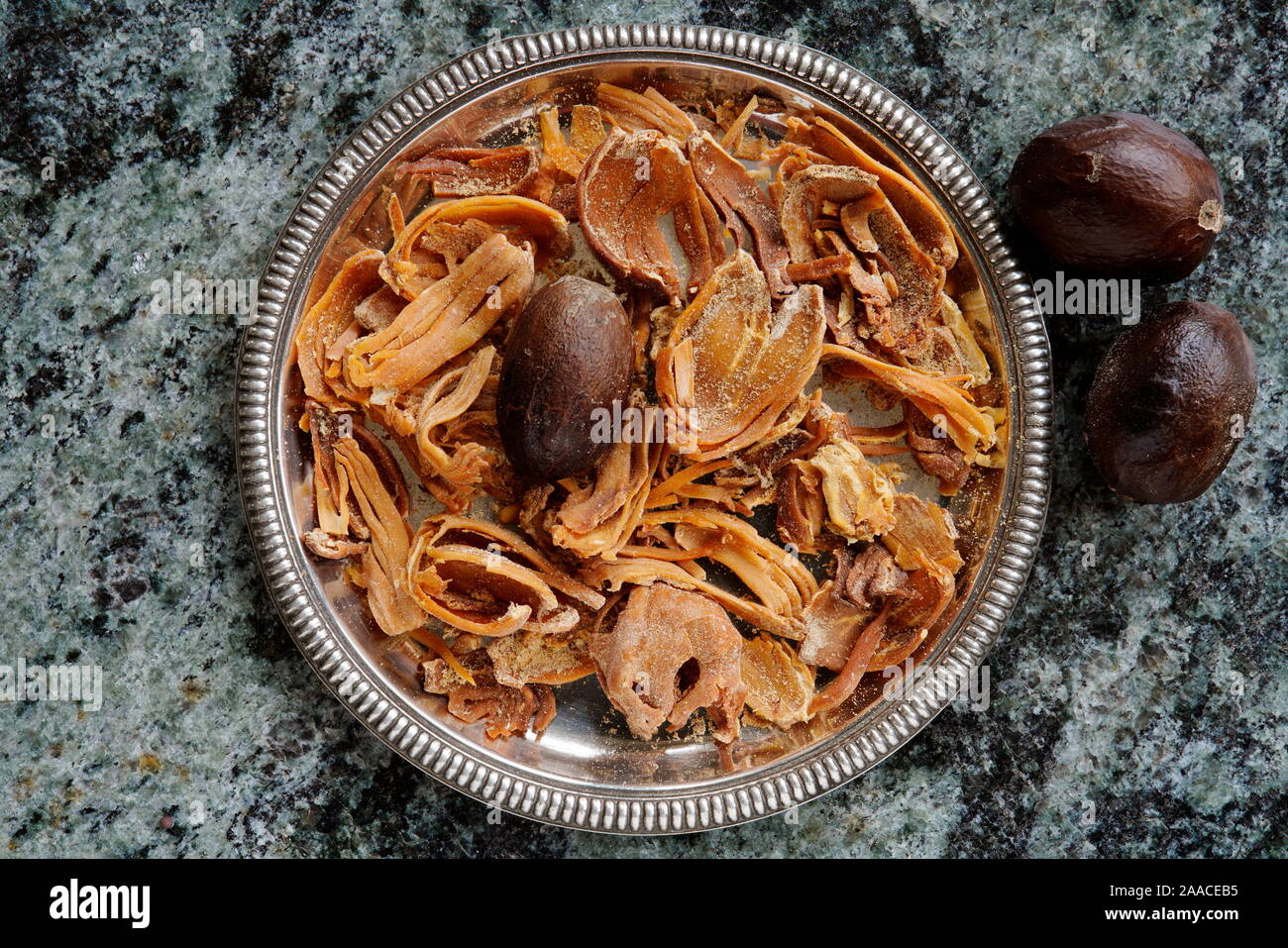 Nutmegs (Myristica fragrans) whole and Mace all over, India, Asia Stock Photo