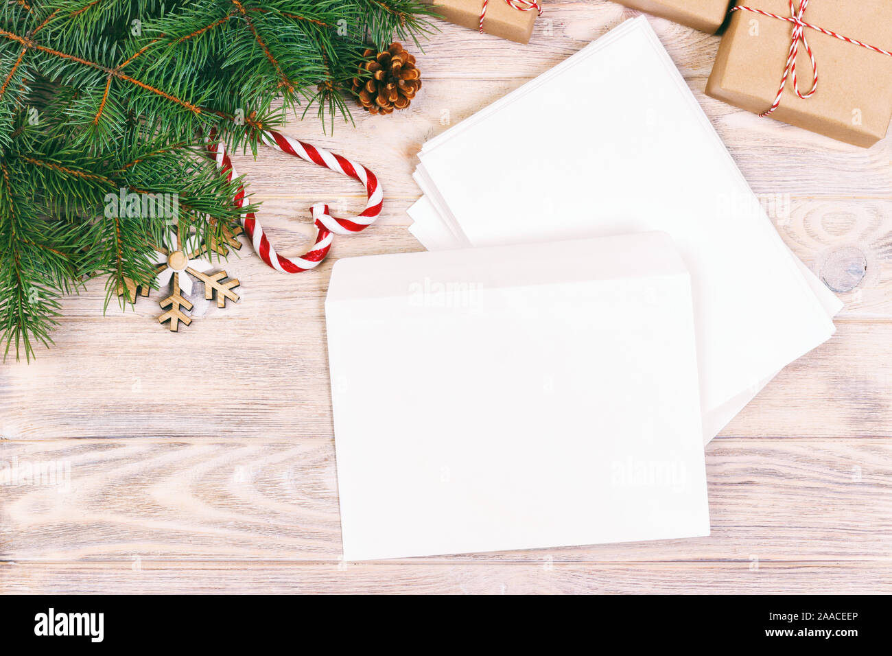 Empty envelope with wishlist for Santa Claus laid on a wooden table. Toned. Stock Photo