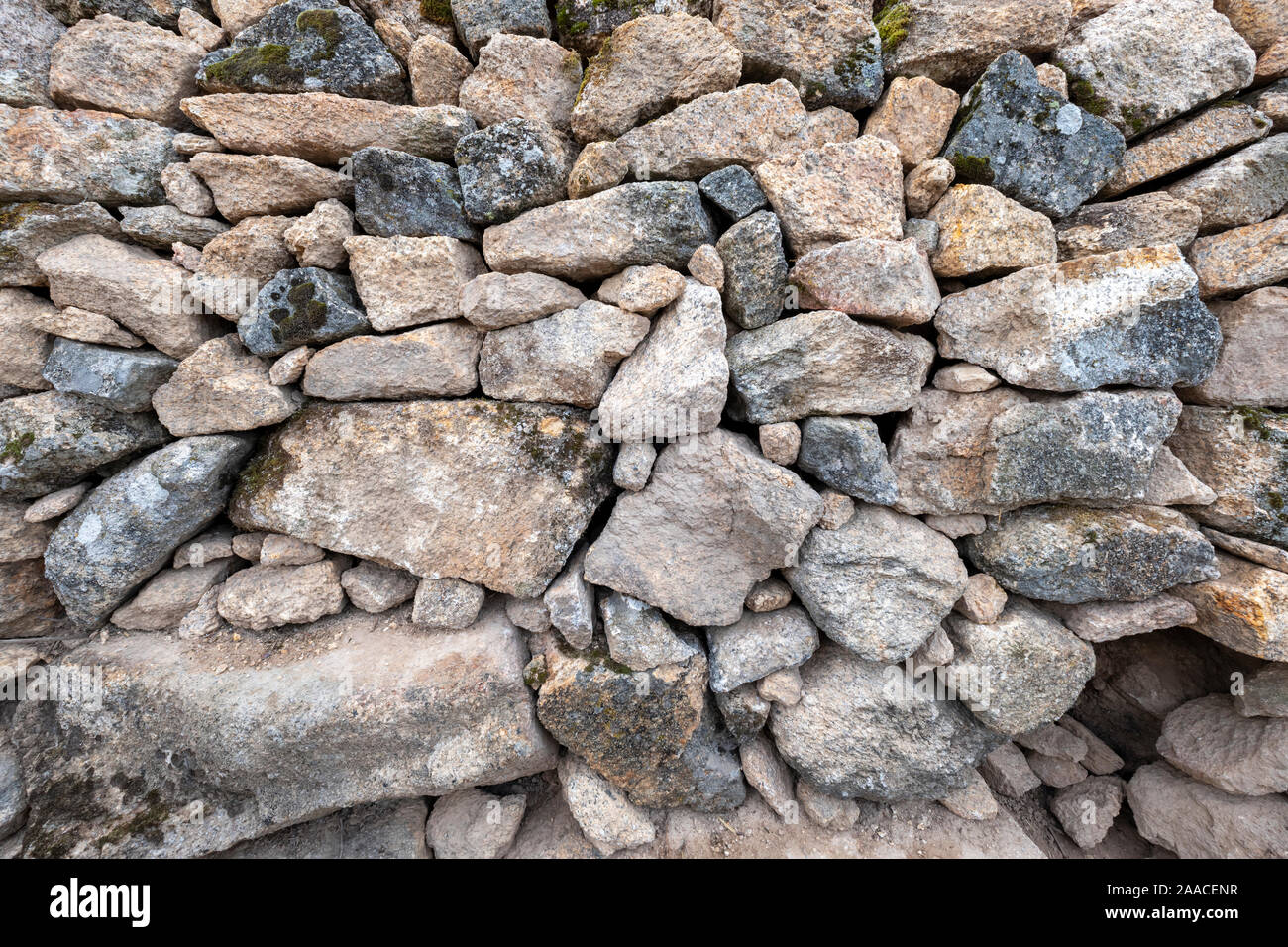 background of large and small hand-stacked natural stones without cement Stock Photo