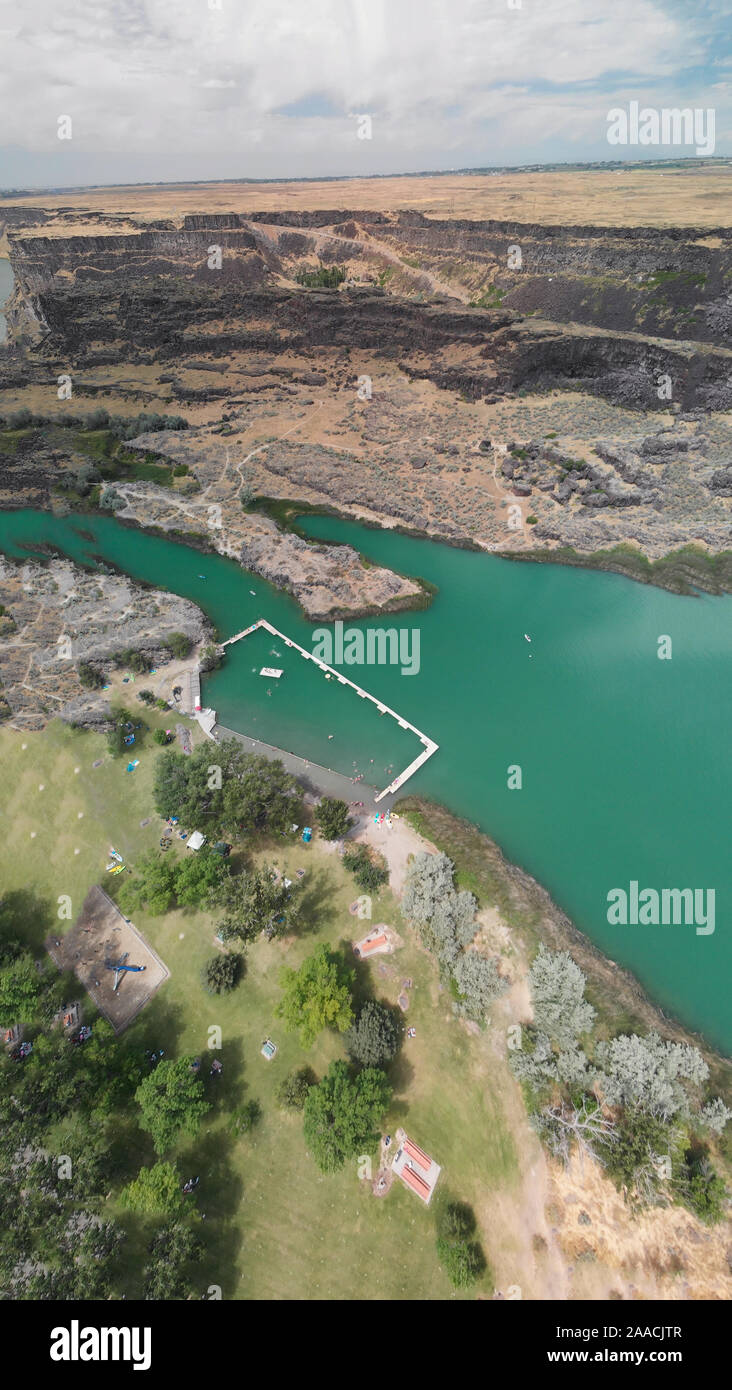 Panoramic aerial view of beautiful green lake in a mountain scenario. Stock Photo