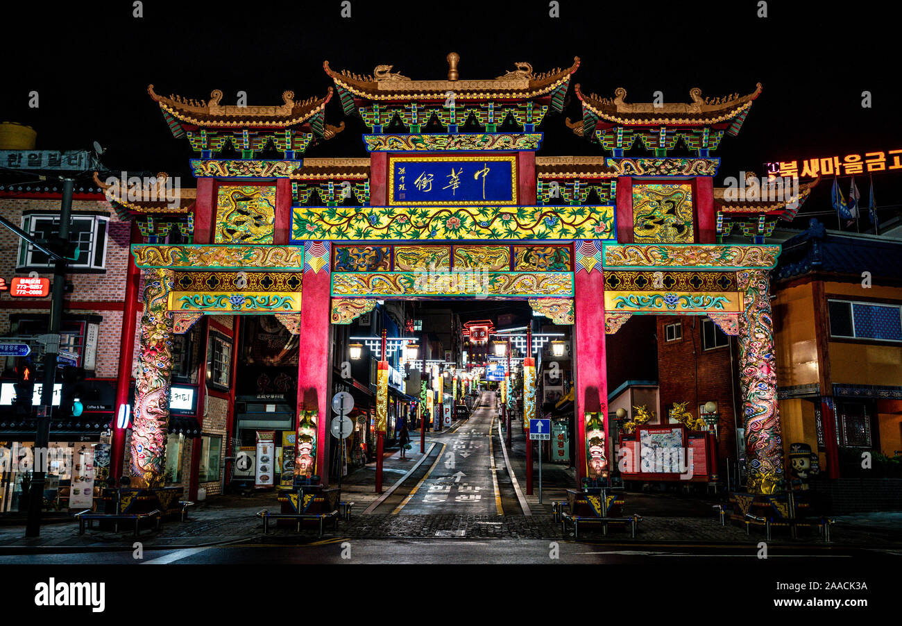 Incheon Korea , 7 October 2019 : Incheon Chinatown entrance with Chinese traditional gate illuminated at night in Incheon South Korea Stock Photo