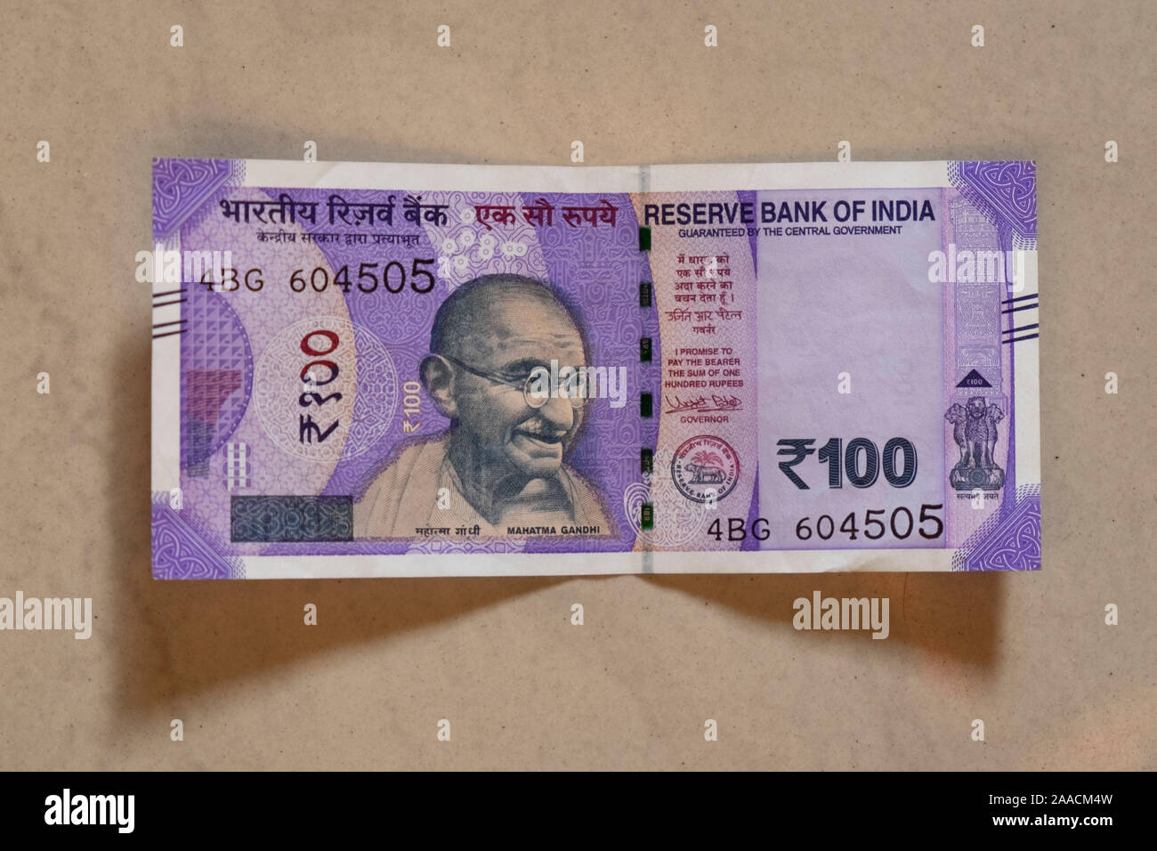 Front of new Indian 100 Rupee note on plain background Stock Photo