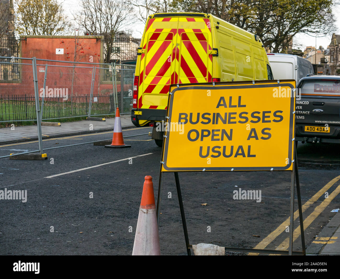 Leith, Edinburgh, Scotland, United Kingdom. 21st Nov, 2019. Trams to Newhaven work starts: Constitution Street is closed to traffic for the next 2-3 years to build the extension for Edinburgh's tram line from to Newhaven, with 8 more stops over 2.91 miles. Barriers along the road with an All Businesses Open as Usual road sign. The work is being undertaken by SFN (Sacyr Farrans Neopul) and MUS (Morrison Utility Services) Stock Photo