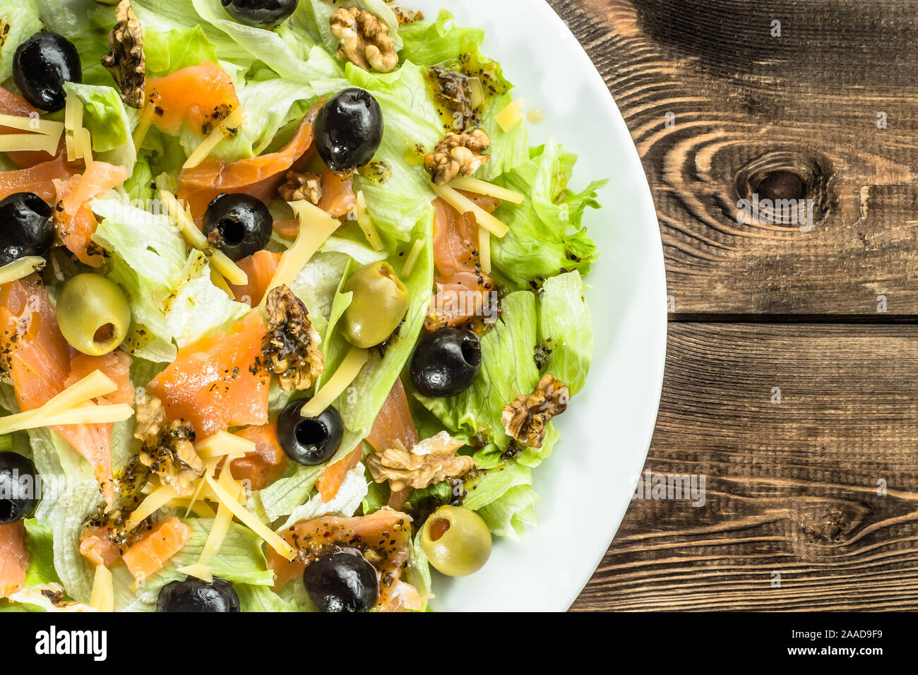 Mediterranean salad with vegetables, salmon and olives, healthy food concept Stock Photo Alamy