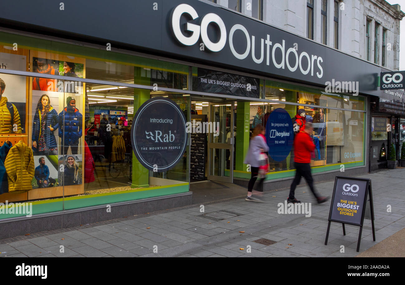 People strolling through a winter apparel store in Southport, Merseyside, UK, owned by GO Outdoors, a retail brand that specialises in camping goods, tents, outdoor clothing and footwear. Stock Photo