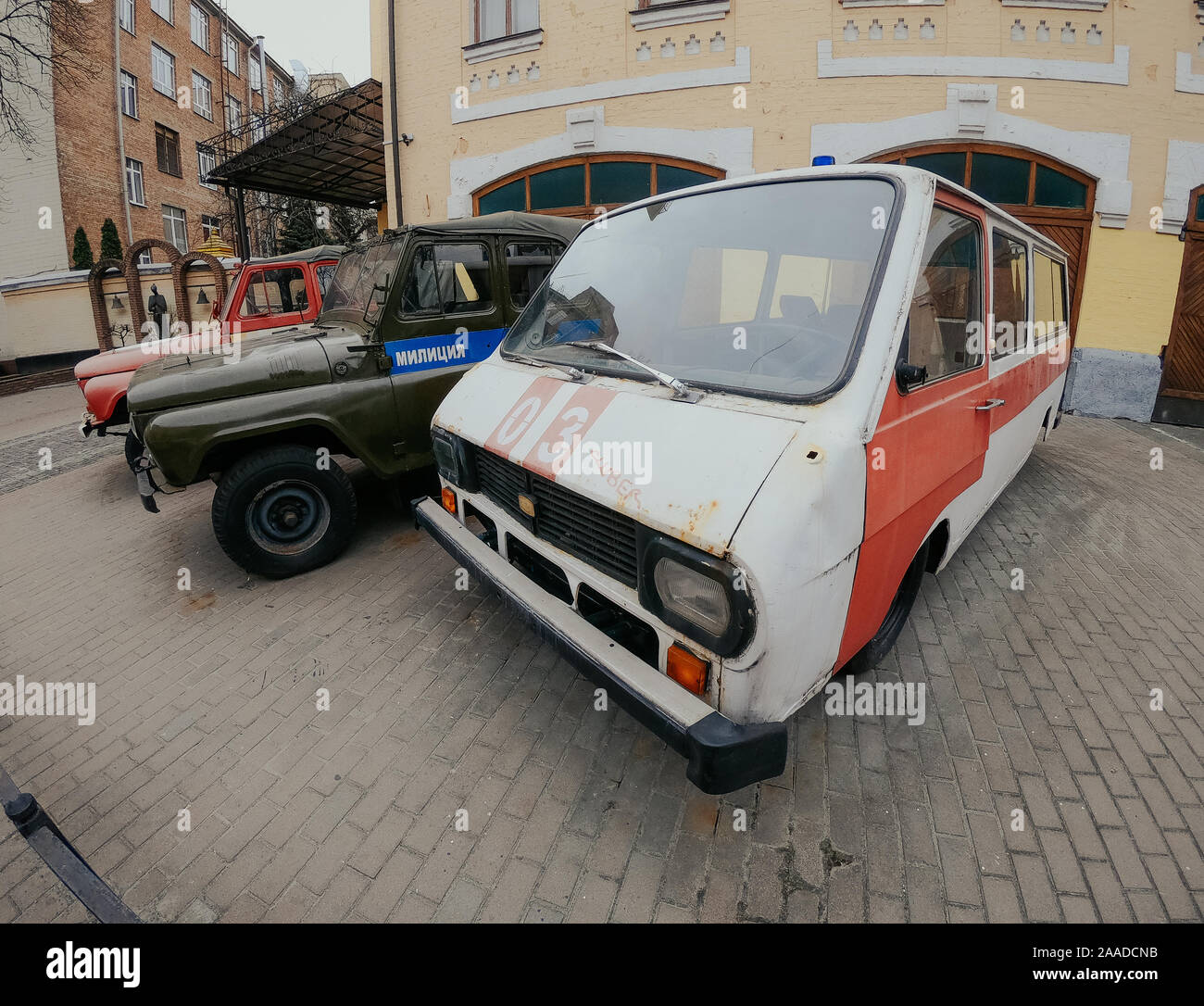 Old broken and rusty USSR times UAZ and LATVIA Cars in summer Kiev Stock Photo