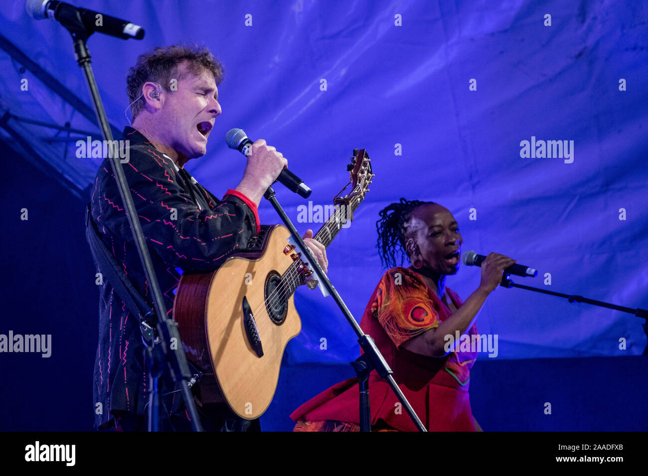 Johnny Clegg (left) and backing vocalist Mandisa Dlanga (right) sing