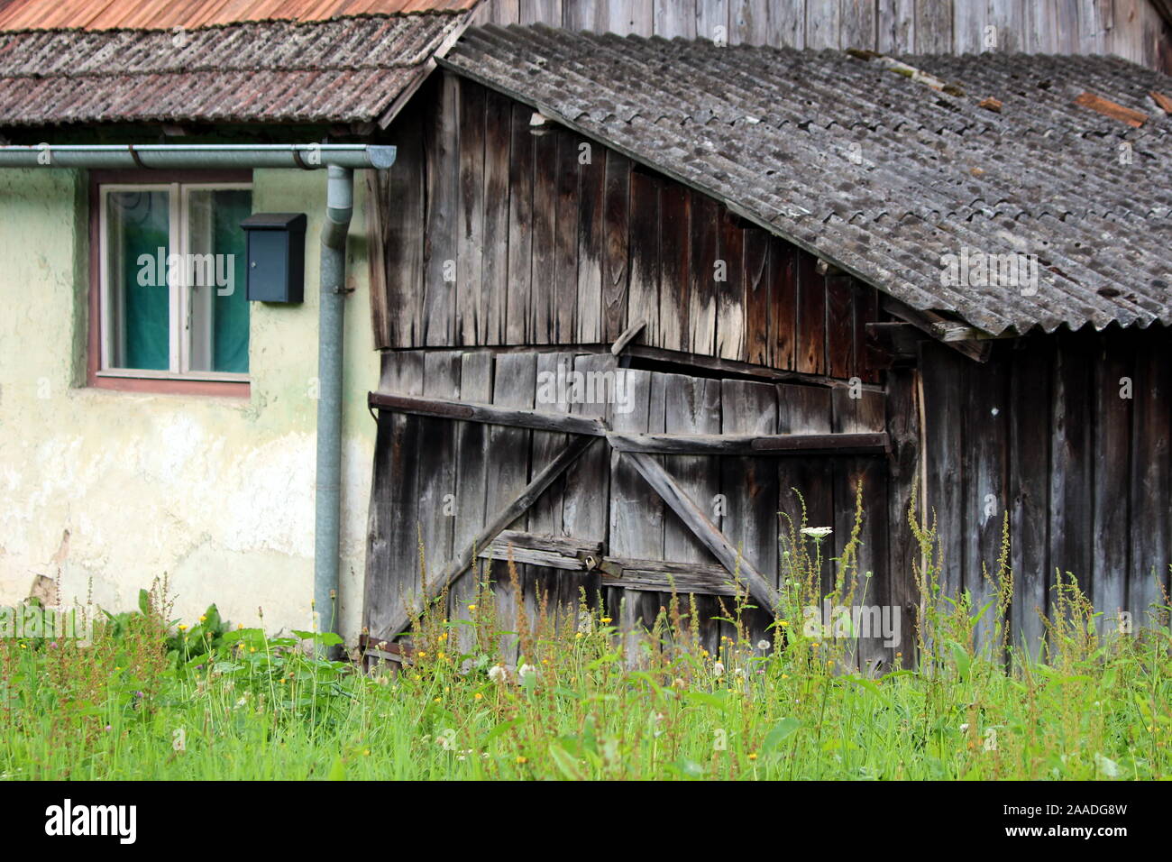 Attached Dilapidated Old Cracked Garage Doors Made From Wooden