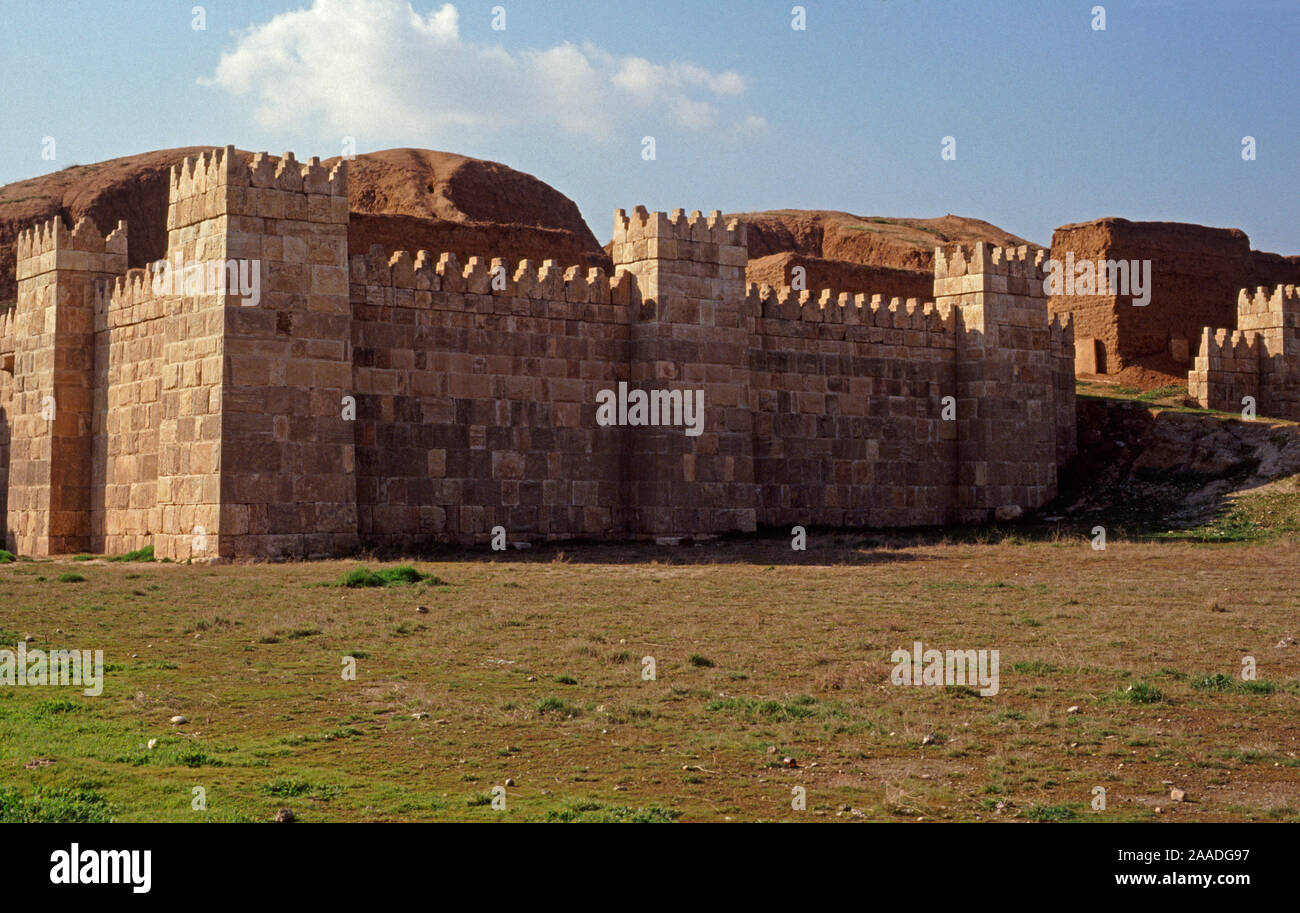 Ancient Assyria reconstructed section of the wall that once surrounded the capital, Nineveh, now engulfed by the modern city of Mosul, Iraq.  In 2014 Hatra was taken over by Islamic State militants and much of the site was destroyed in 2015. Stock Photo