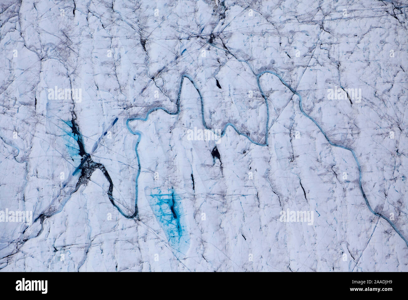 Aerial view of meltwater channels in ice cap northeast of Sermeq