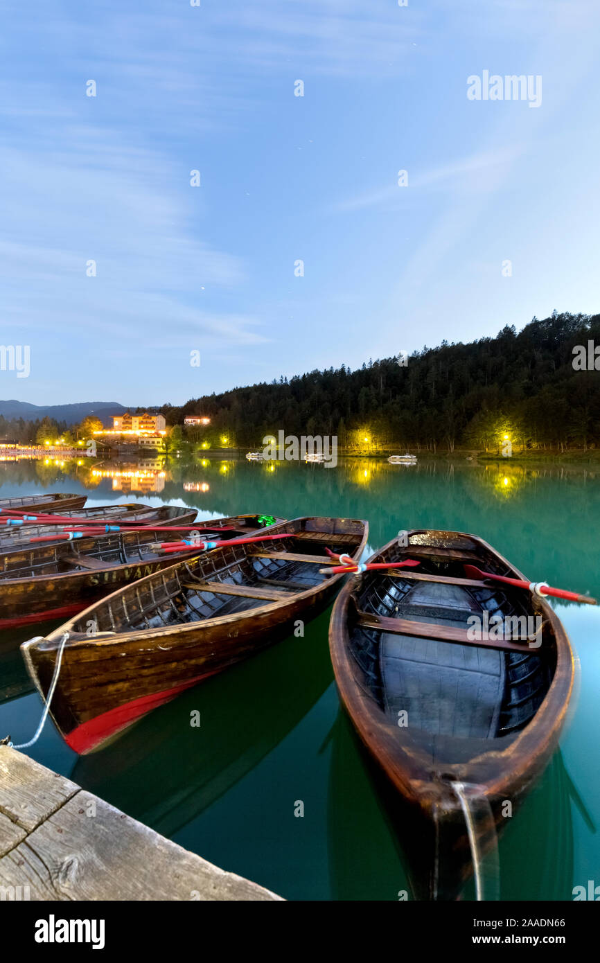 Rowboats moored at the Lake Lavarone. The lake is famous for being the holiday destination of the psychoanalyst Sigmund Freud. Trentino, Italy. Stock Photo