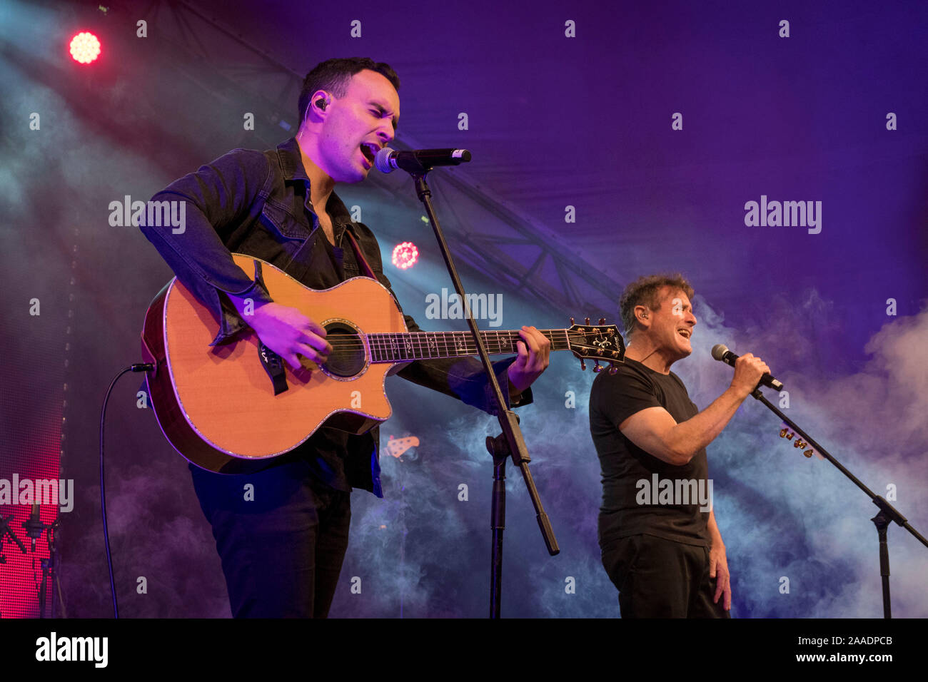 South African musician Jesse Clegg (L) performs with his father, Johnny Clegg (R) during one of Johnny's last-ever concerts, Kirstenbosch, Cape Town. Stock Photo