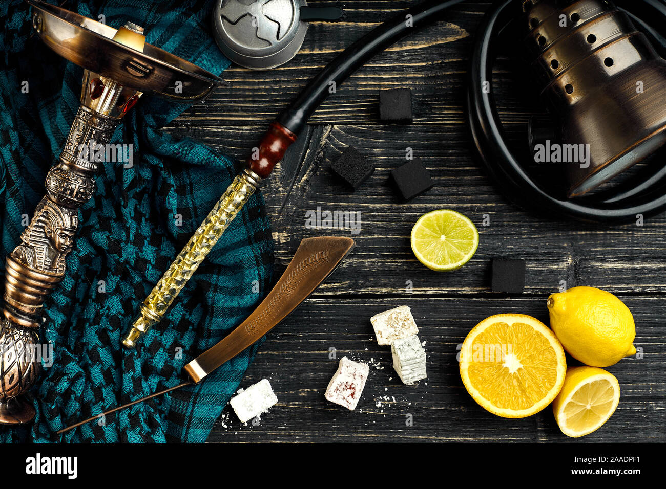 Top view of Hookah with orange fruit on a wooden background Stock Photo
