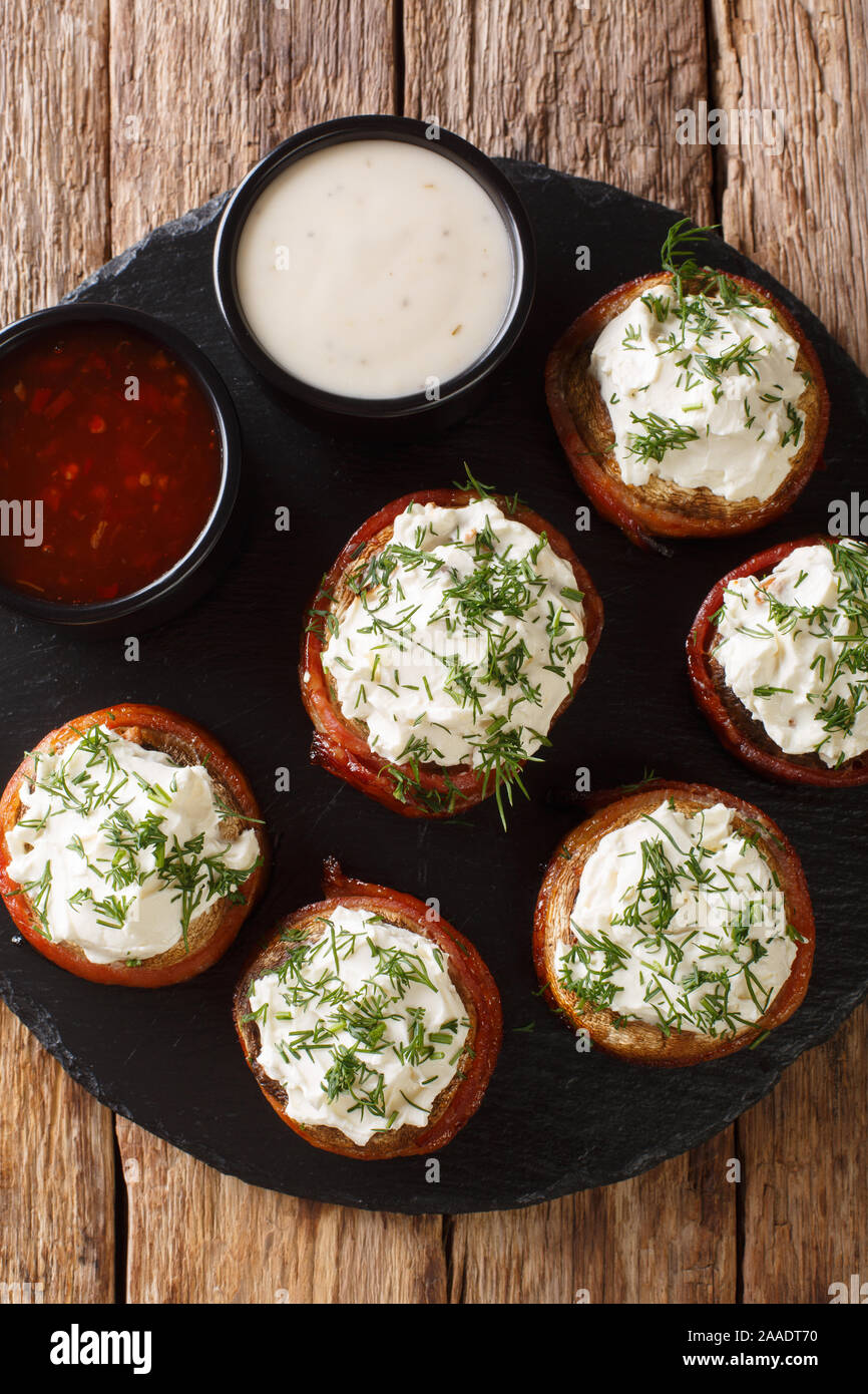 Hot Portobello mushrooms with cream filling wrapped in bacon with