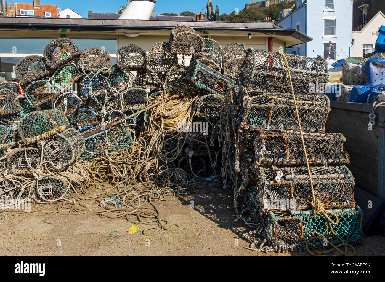 Stacks of lobster and crab pots pot sea fishing industry on the quayside Scarborough North Yorkshire England UK United Kingdom GB Great Britain Stock Photo