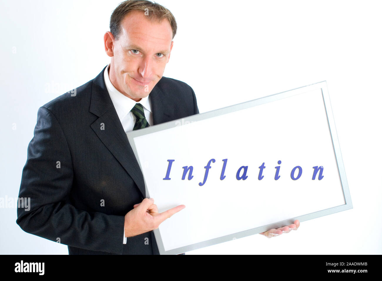 Geschäftsmann hält Schreibtafel "Inflation" (mr) Stock Photo