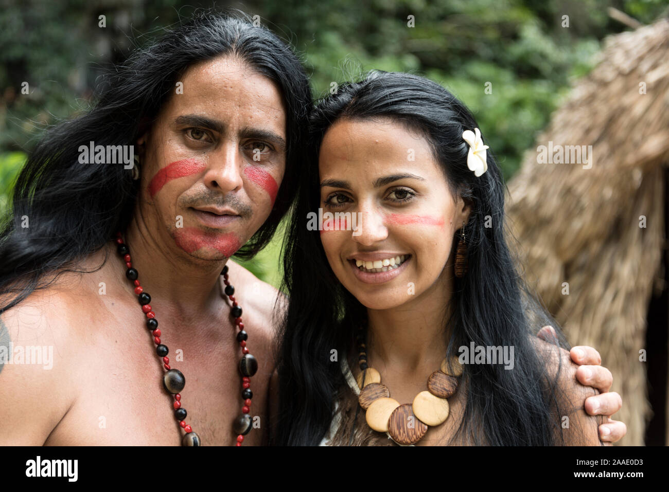 A couple of the Taino-Arawak people, performing some traditional music to visiting tourists, visiting the Cueva del Indio, (Indian Cave), a cave, firs Stock Photo