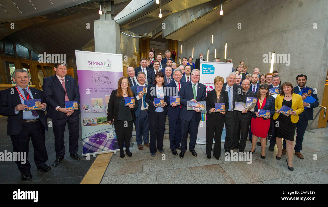 Edinburgh, UK. 21 November 2019. Pictured: (centre) Party Leaders: Richard Leonard MSP; Jackson Carlaw MSP; Nicola Sturgeon MSP; Mike Rumbles MSP; Patrick Harvie MSP. SiMBA and the Scottish Parliament have organised a photocall: ‘SiMBA Book for Book Week Scotland' to celebrate the inclusion of My Little Star, a beautiful picture book by Mark Sperring (author) and Nicola o' Byrne (illustrator) in our SiMBA Memory Boxes during Book Week Scotland 2019 (18 to 24 November). My Little Star is a gift to bereaved families sadly affected by baby loss. Credit: Colin Fisher/Alamy Live News Stock Photo