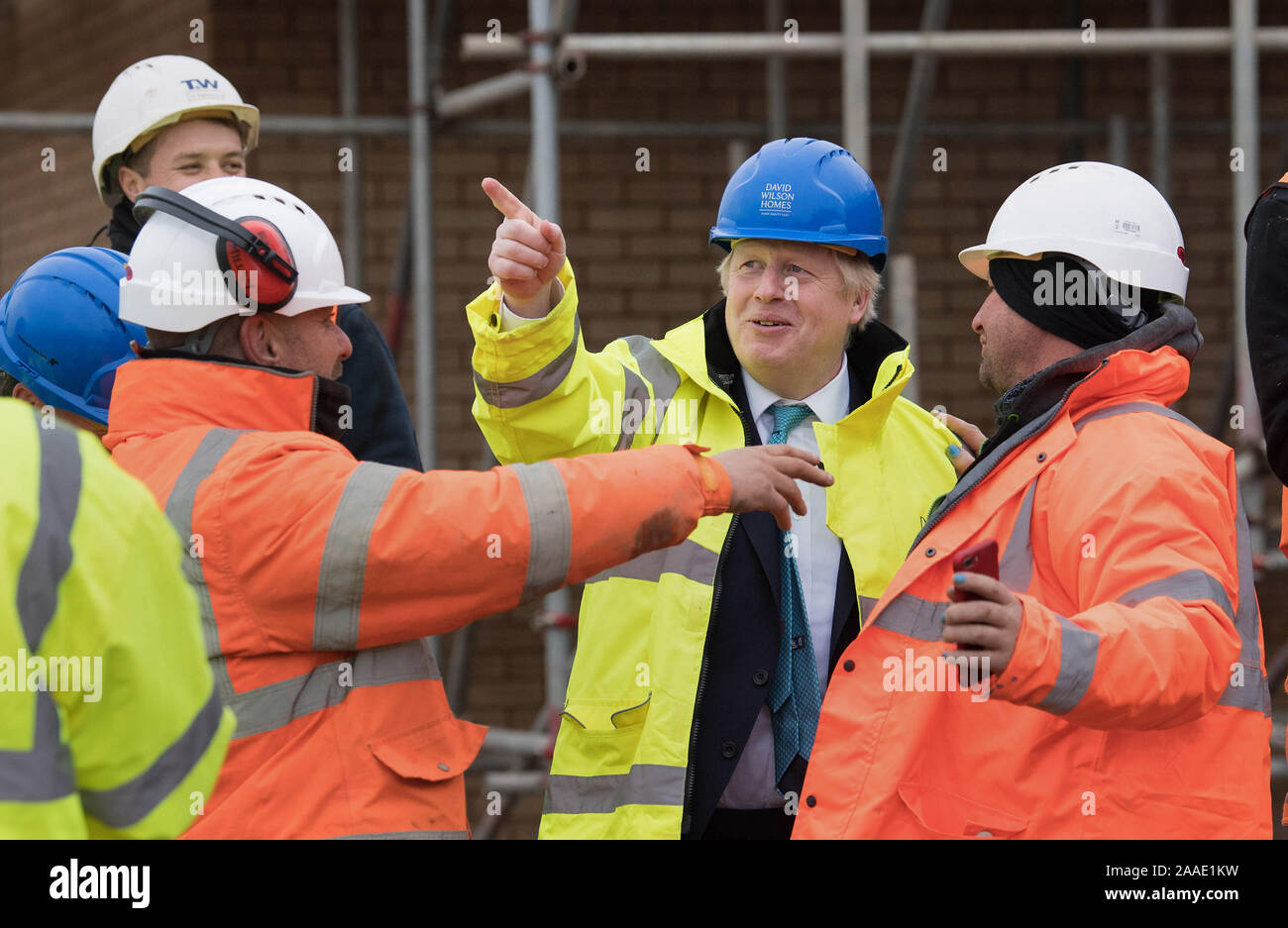 Prime Minister Boris Johnson (2nd right) during a visit to David Wilson