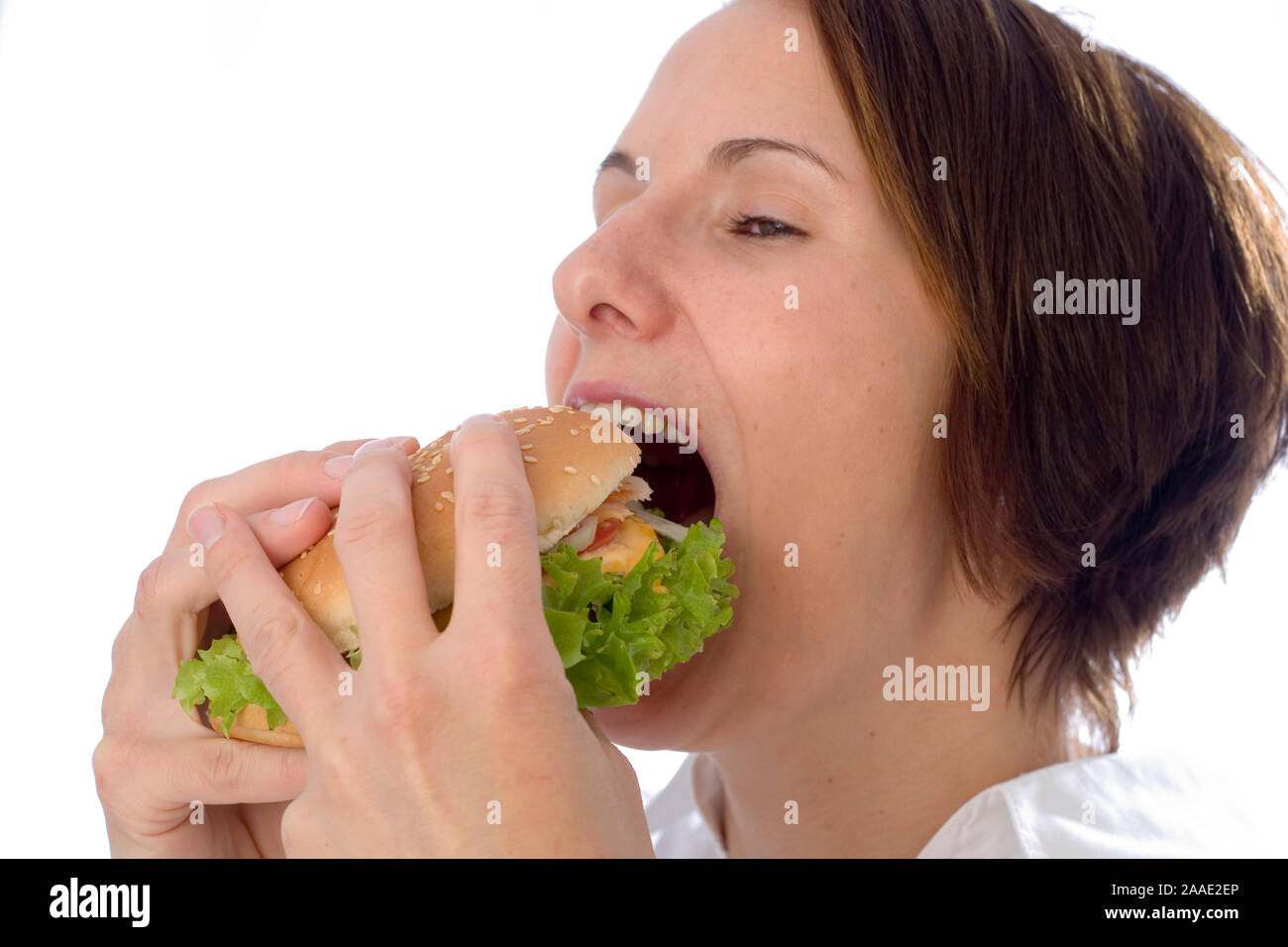 Frau isst einen Hamburger (mr) Stock Photo
