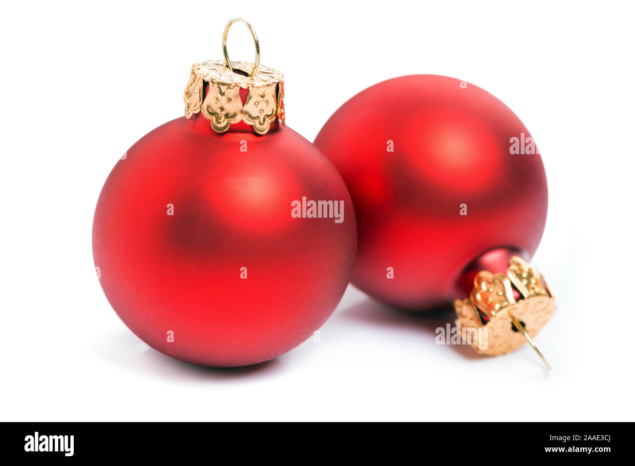 Two red christmas baubles isolated over a white background. Stock Photo