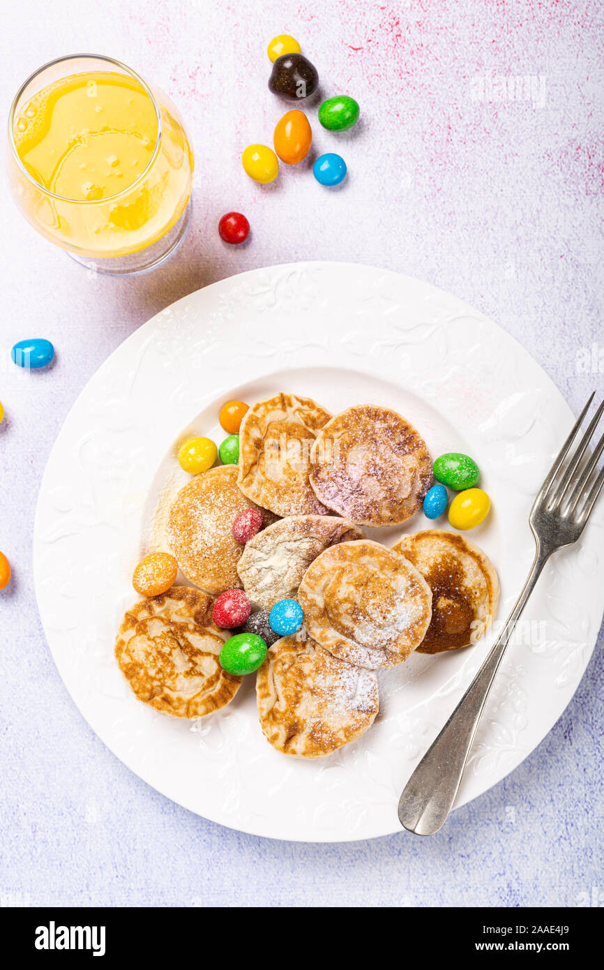 Dutch mini pancakes called poffertjes Stock Photo