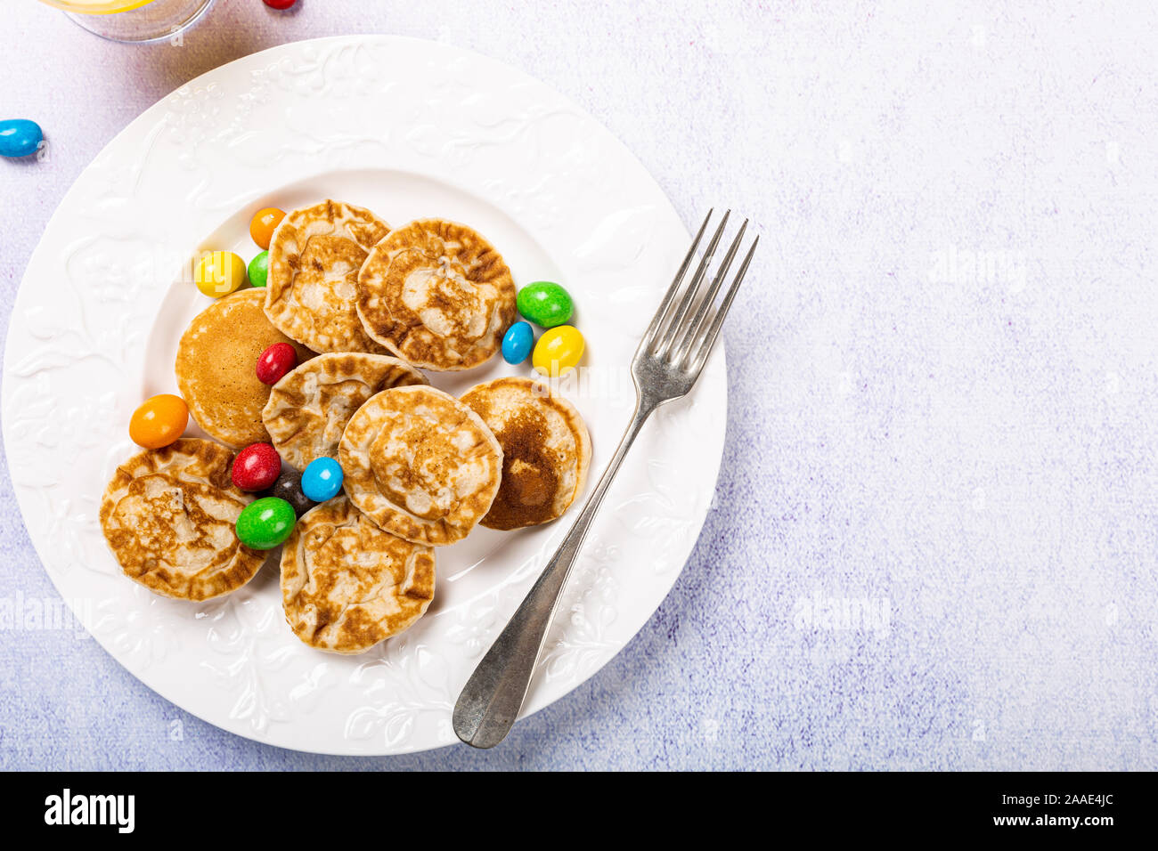 Dutch mini pancakes called poffertjes Stock Photo