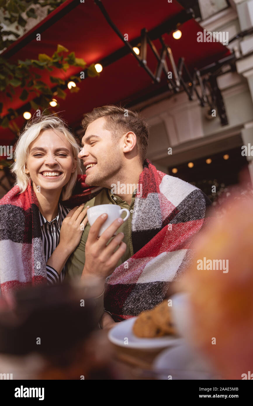 Cheerful couple enjoying their date drinking coffee Stock Photo