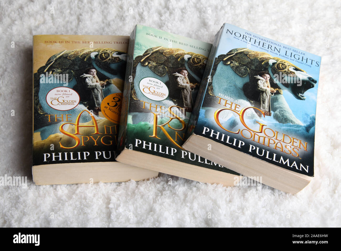 Philip Pullman His Dark Materials Paperbook Book stack on white Stock Photo
