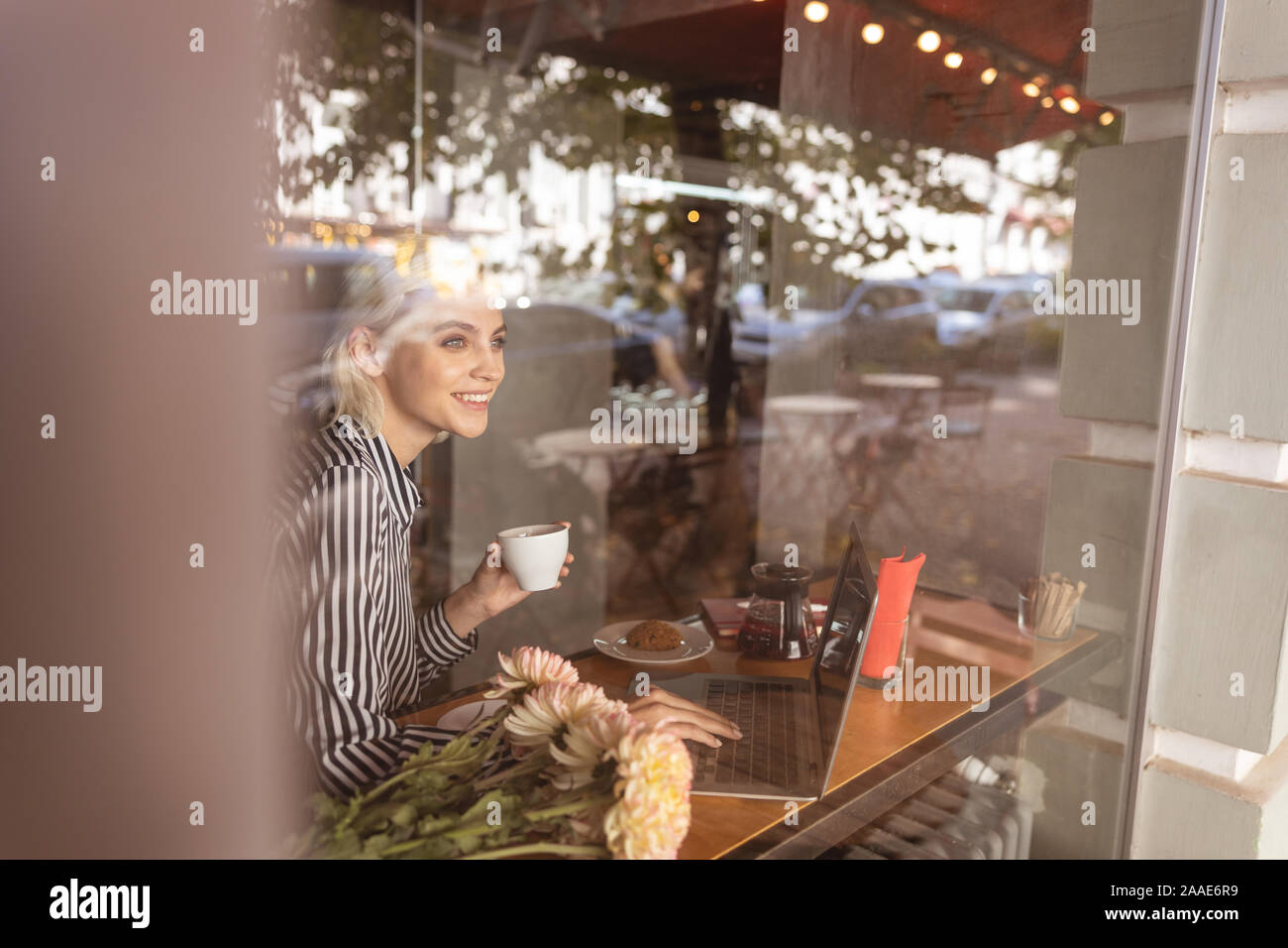 Cheerful lady feeling happy working on her project Stock Photo