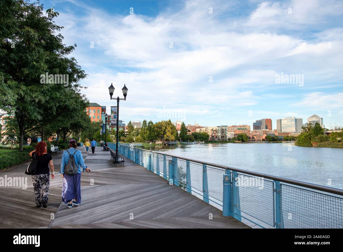 The River walk with skyline in summer and Christiana River, Wilmington, Delaware, USA Stock Photo