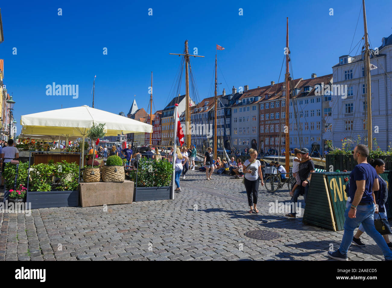 People walking along the Waterfront in Copenhagen, Denmark Stock Photo
