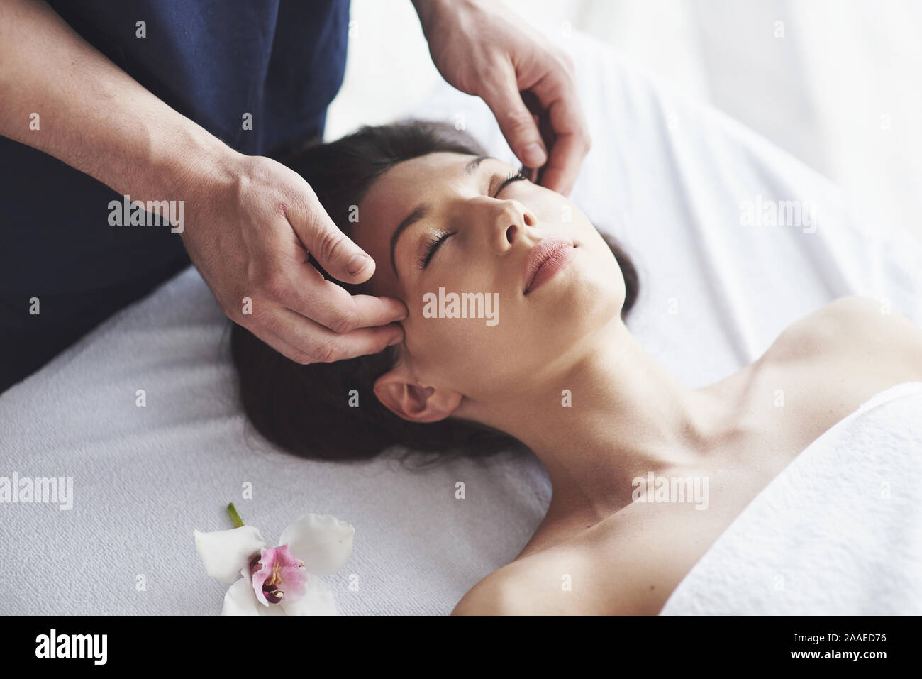 Traditional oriental massage therapy and beauty treatments. Stock Photo