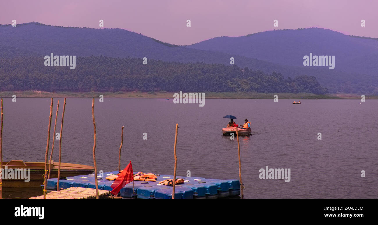 Panorama,rolling,forested,Dalma,hills,Burundl lake,happy,couple,boating,on lake water,Ghatsila,Jharkhand, Stock Photo
