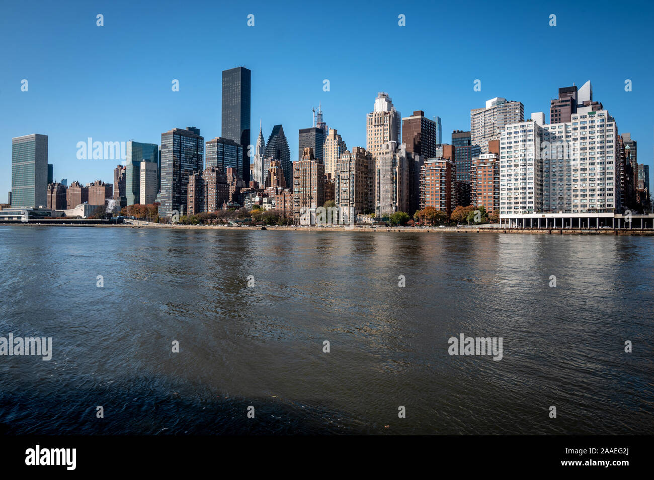 The New York City skyline from Roosevelt Island in the East River Stock ...