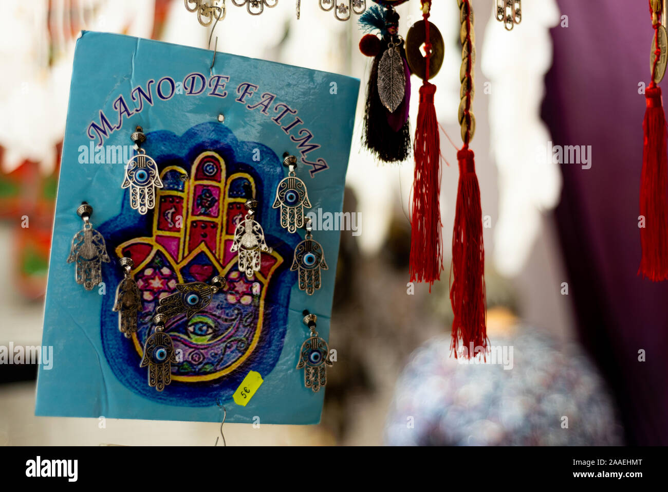 jamsa hand amulet earrings and pendants for sale in street market stall, a symbol of superstition and search for luck and protection Stock Photo
